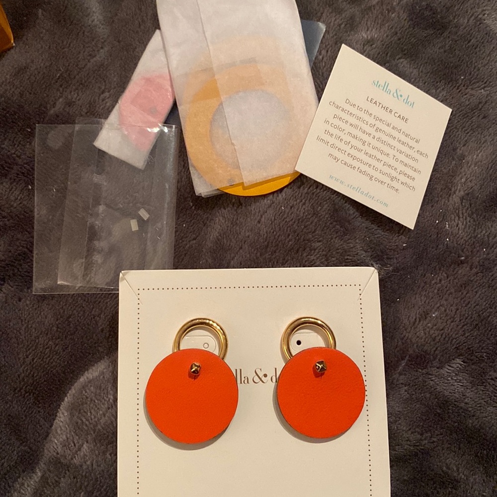Leather and gold interchangeable earrings from Stella. And Dot
